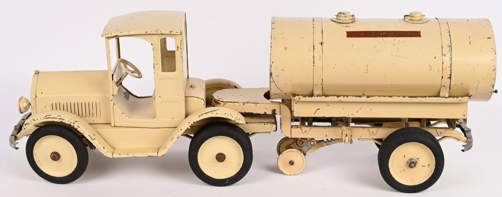 STURDITOY TRACTOR TRAILER DAIRY COMPANY TRUCK: Sturditoy pressed steel Tractor Trailer Dairy Company Truck. Outstanding all original with exceptional paint and decals. Has original spigot missing down spouts. A very rare and desirable truck. One
