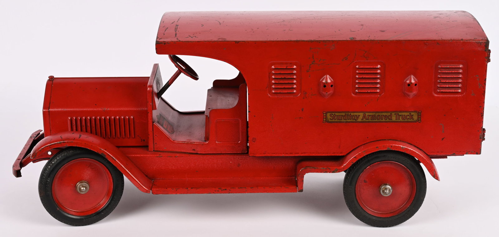 STURDITOY ARMORED CAR: Sturditoy pressed steel Armored Car. All original with exceptional paint and decals. Paint does have some heat crazing to paint. Displays beautiful. Hard to find a better example. 25" Excellent