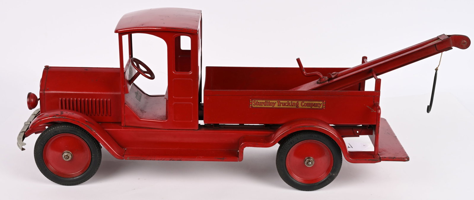 STRUDITOY TRUCKING COMPANY WRECKER: Sturditoy pressed steel Trucking Company Wrecker. All original with exceptional paint and decals. Super clean truck. Has replaced tow hook. A very nice example. 32" Excellent