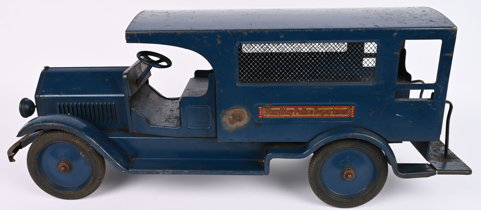 STURDITOY POLICE DEPARTMENT PATROL: Sturditoy pressed steel Police Department Patrol. Very hard to find truck. All original with very nice paint and decals. Has minor burn spot on side. Still displays very well. 27" Excellent