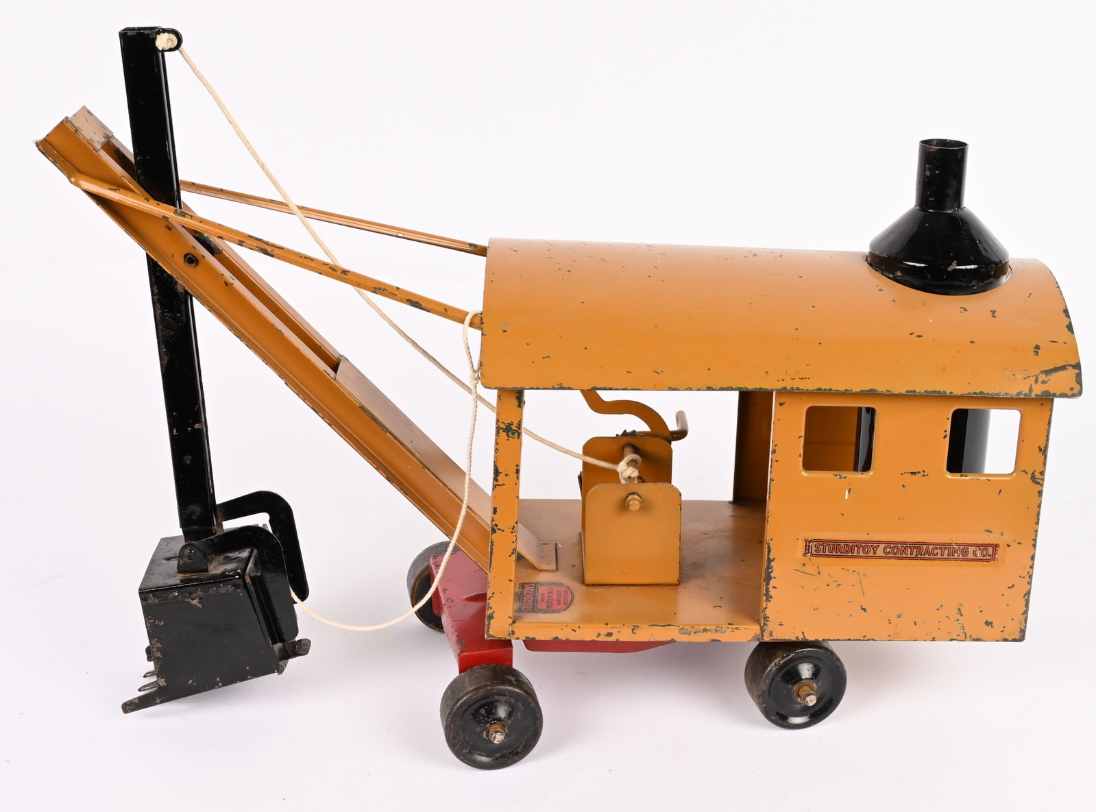 STURDITOY CONTRACTING COMPANY STEAM SHOVEL: Sturditoy pressed steel Contracting Company Steam Shovel. Rare tan color version. All original with nice paint and decals. Only one this color we have seen. 21" Excellent
