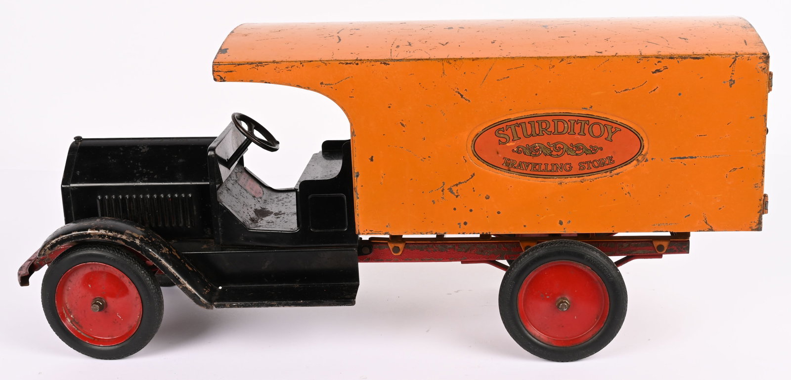 STURDITOY TRAVELING STORE: Sturditoy pressed steel Traveling Store. Original paint and decals. Rear door hinges have been repaired. A nice truck with some normal wear. 27" Very Good-Excellent