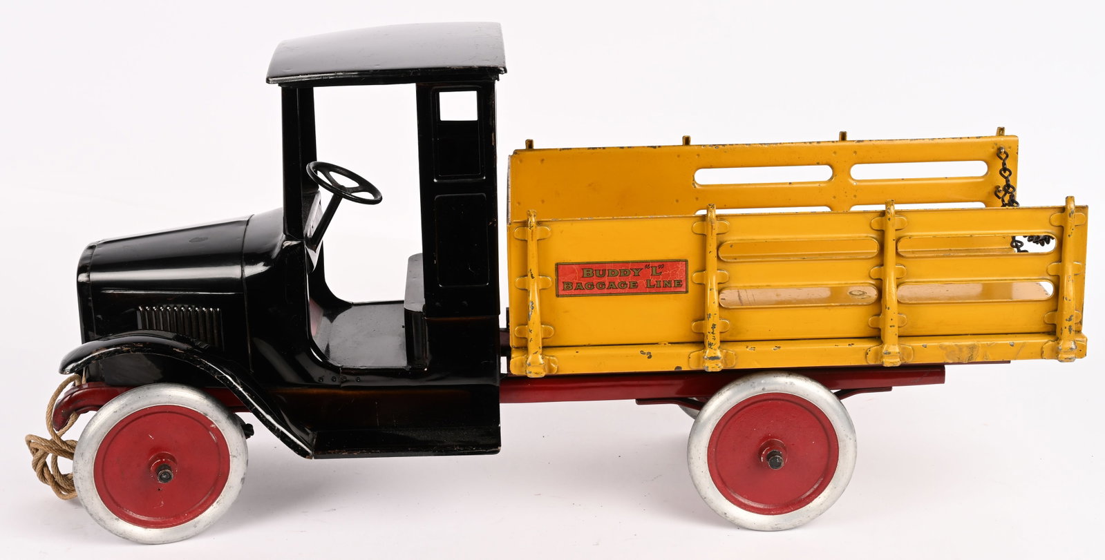 BUDDY L BAGGAGE TRUCK: Buddy L pressed steel Baggage Truck. All original with exceptional paint and decals. Has original chains and pull cord. Hard to find a better example. 27" Excellent
