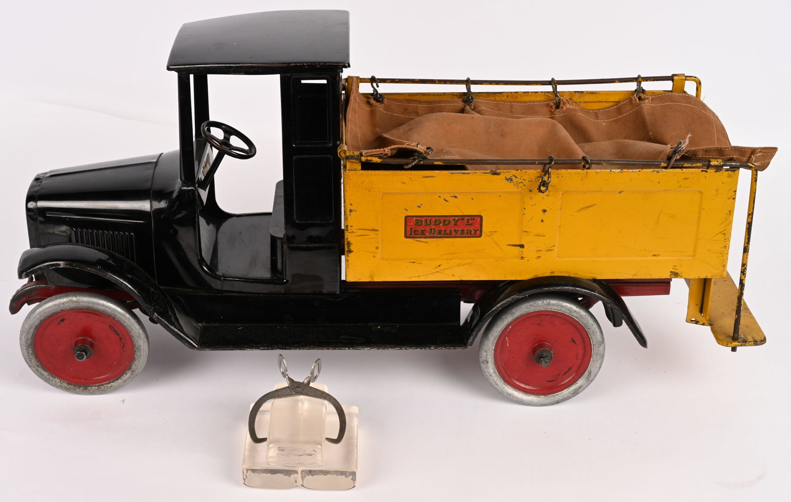 BUDDY L ICE TRUCK: Buddy L pressed steel Ice Truck. All original with nice paint and decals. Still has original canvas. Comes with repro ice and tongs. A very nice looking truck. 27" Excellent