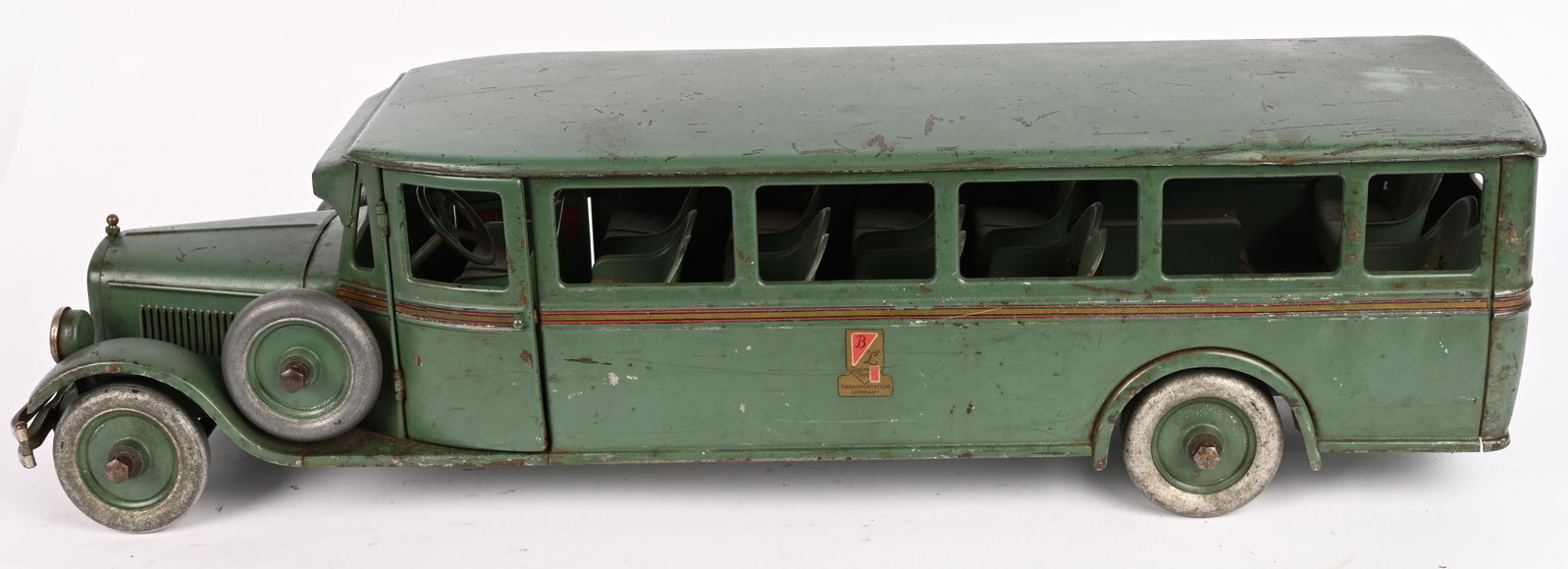 BUDDY L PRESSED STEEL BUS: Buddy L pressed steel Bus. All original with very nice paint and decals. Has opening doors and dual side mounts. A beautiful example of a very desirable toy. 29" Excellent