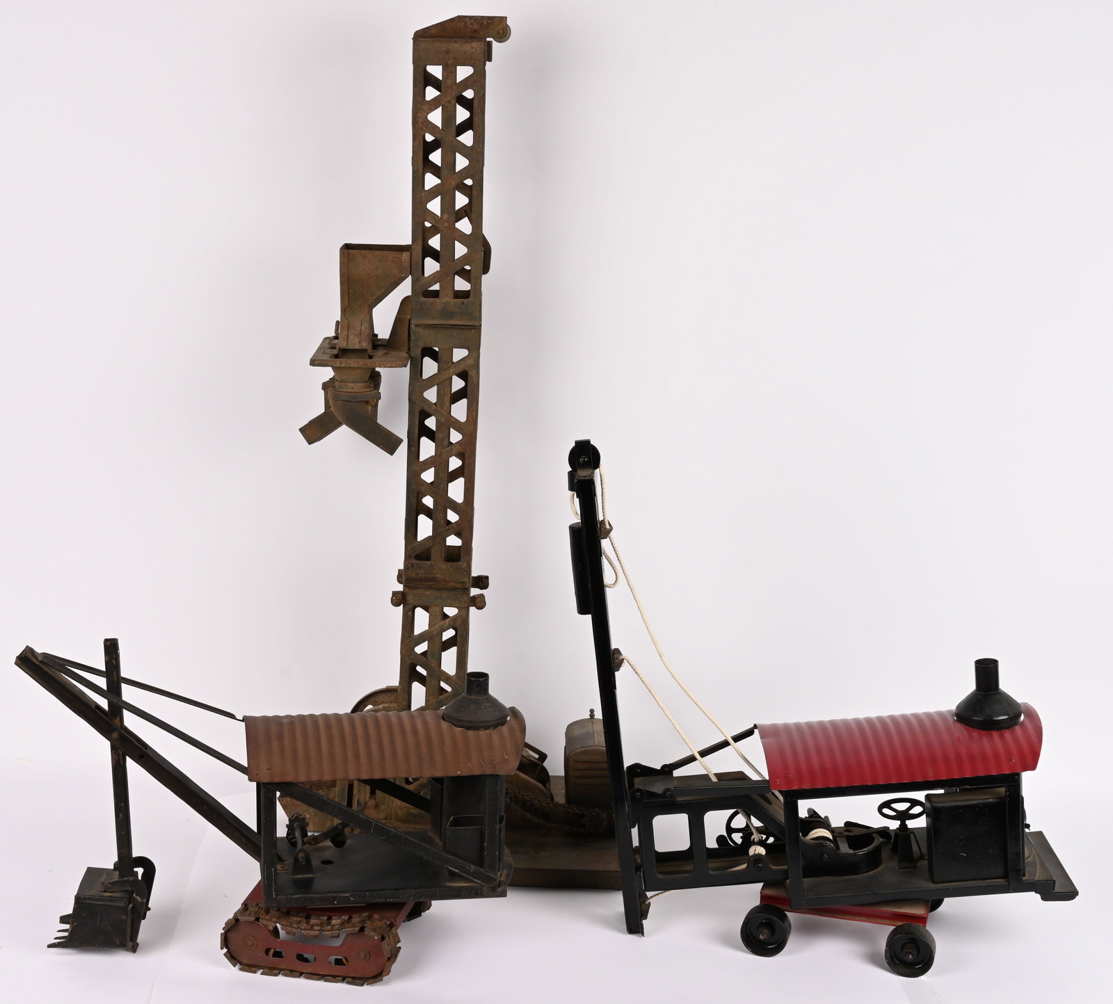 BUDDY L CONSTRUCTION TOYS: Buddy L pressed steel Junior Steam Shovel on Tracks. All original with decent paint. Plus Buddy L pressed steel Hoisting Tower. All original as found condition. Missing chutes. Plus Buddy L pressed