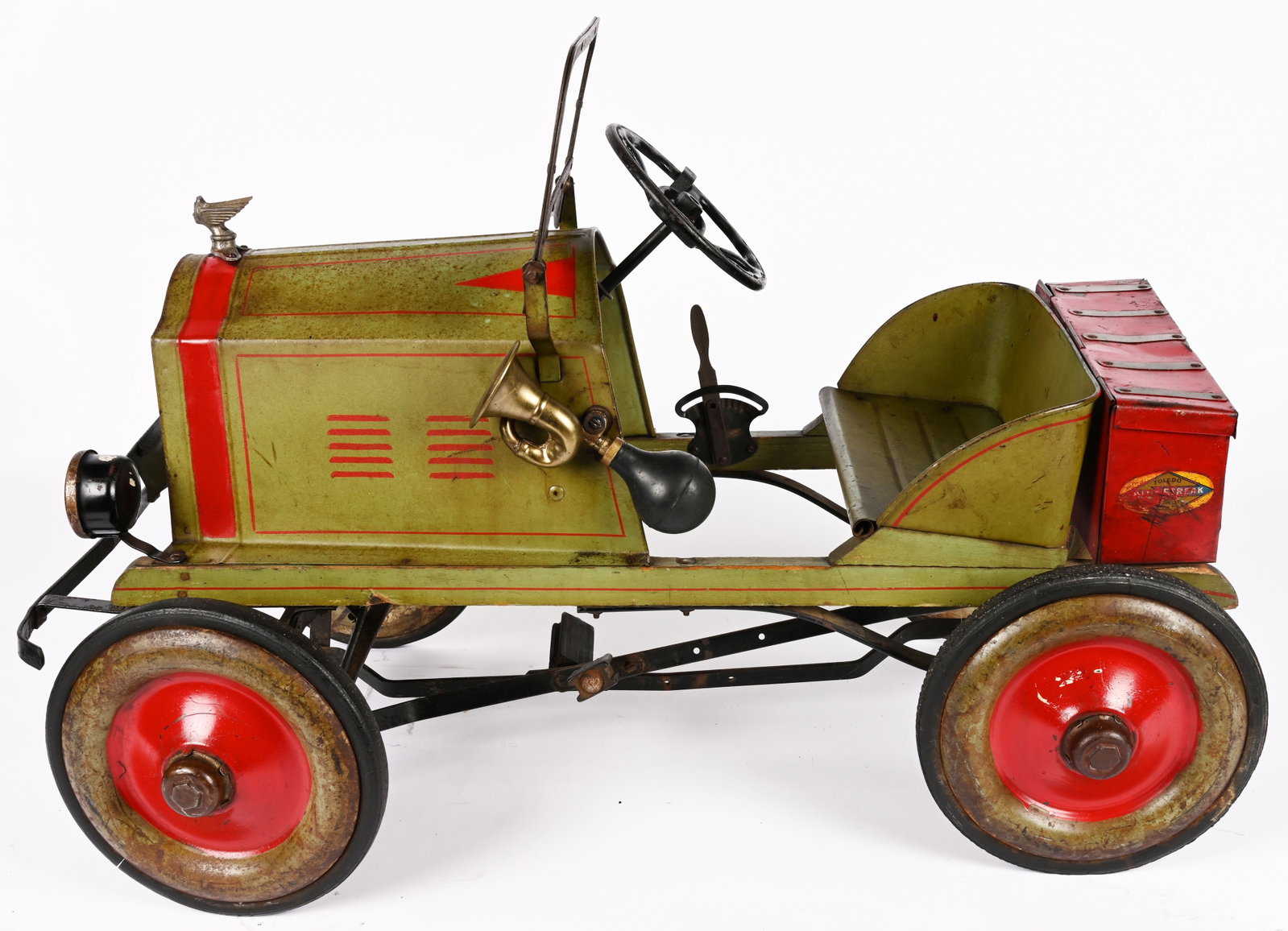 1920s TOLEDO OLDSMOBILE PEDAL CAR: 1920s Toledo Oldsmobile Pedal Car. Great original with very nice paint. Has original tool box, hood ornament, and windshield. Very nice colors. A nice little Pedal Car. 38" Excellent