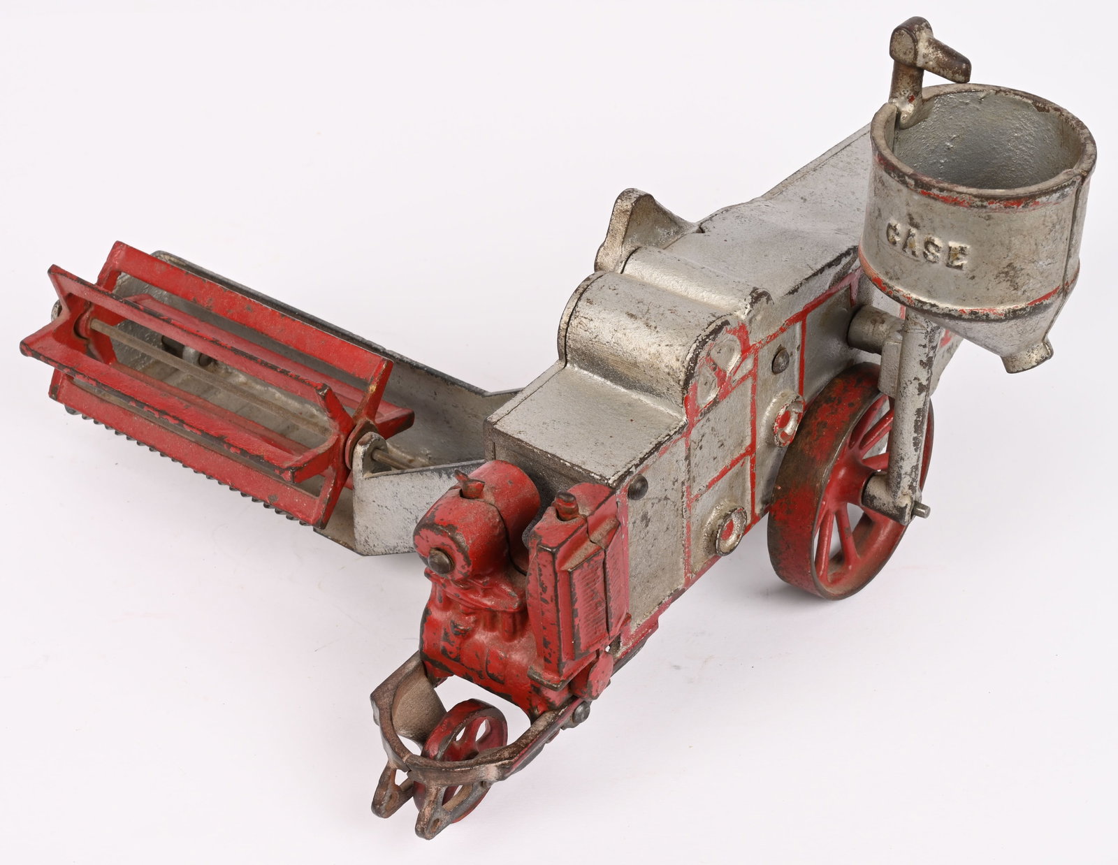 VINDEX CAST IRON CASE COMBINE: Vindex cast iron Case Combine. Scarce large farm toy made in the late 1920's. All original except for small "fan" under tail that is repainted or replaced. Missing clicker underneath. No cracks or
