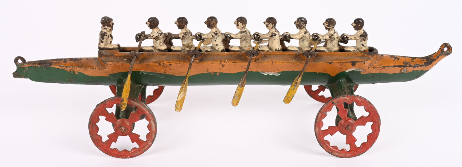 US HARDWARE CAST IRON LARGE RACING SCULL: US Hardware cast iron Rowing Scull features 8 rowers and a Coxswain. Complete and original. Paint should clean to a higher grade. 14" Excellent