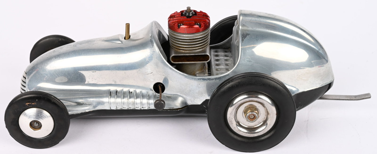 REAL MCCOY GAS POWERED TETHER RACE CAR: Real McCoy Gas Powered Tether Race Car. Nice clean original condition. Has drive trail with McCoy .19 Engine. Nice racer. 11" Excellent