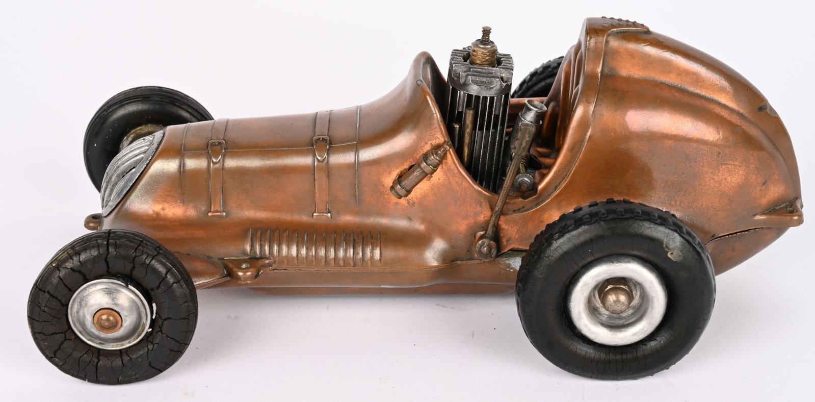 COX THIMBLE DROME CHAMPION GAS POWERED RACER: Roy Cox Thimble Drome Champion. Unusual copper clad finish. All original and complete with gas engine. 10" Excellent