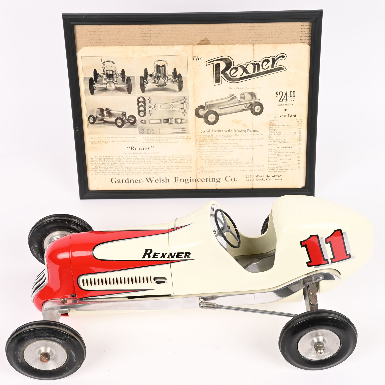 REXNER DELUXE GAS POWERED TETHER RACE CAR: Rexner Deluxe Gas Powered Tether Race Car. Has Dennymite Engine. Wonderful 1940s style Racer. Very well done with great details. Comes with original Rexner Advertisement. 18" Excellent