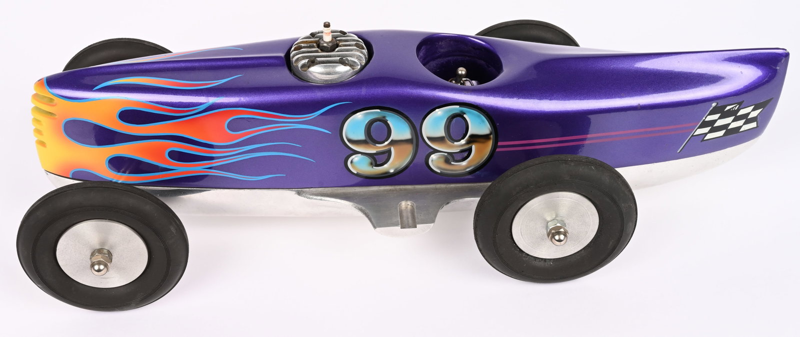 ED #99 GAS POWERED TETHER RACE CAR: Wood and Aluminum #99 Gas Powered Tether Race Car. Aluminum underside has ED embossed into it. Body is wood. Has Hornet Engine. Very nice looking paint job. Unique looking racer. 18" Excellent