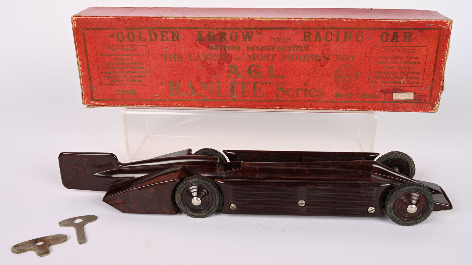 AGL BAKELITE WINDUP GOLDEN ARROW RACER w/ BOX: English Bakelite Windup Golden Arrow Racer. All original in wonderful condition. Windup works. Very unusual tot. Comes with Box. 17" Excellent