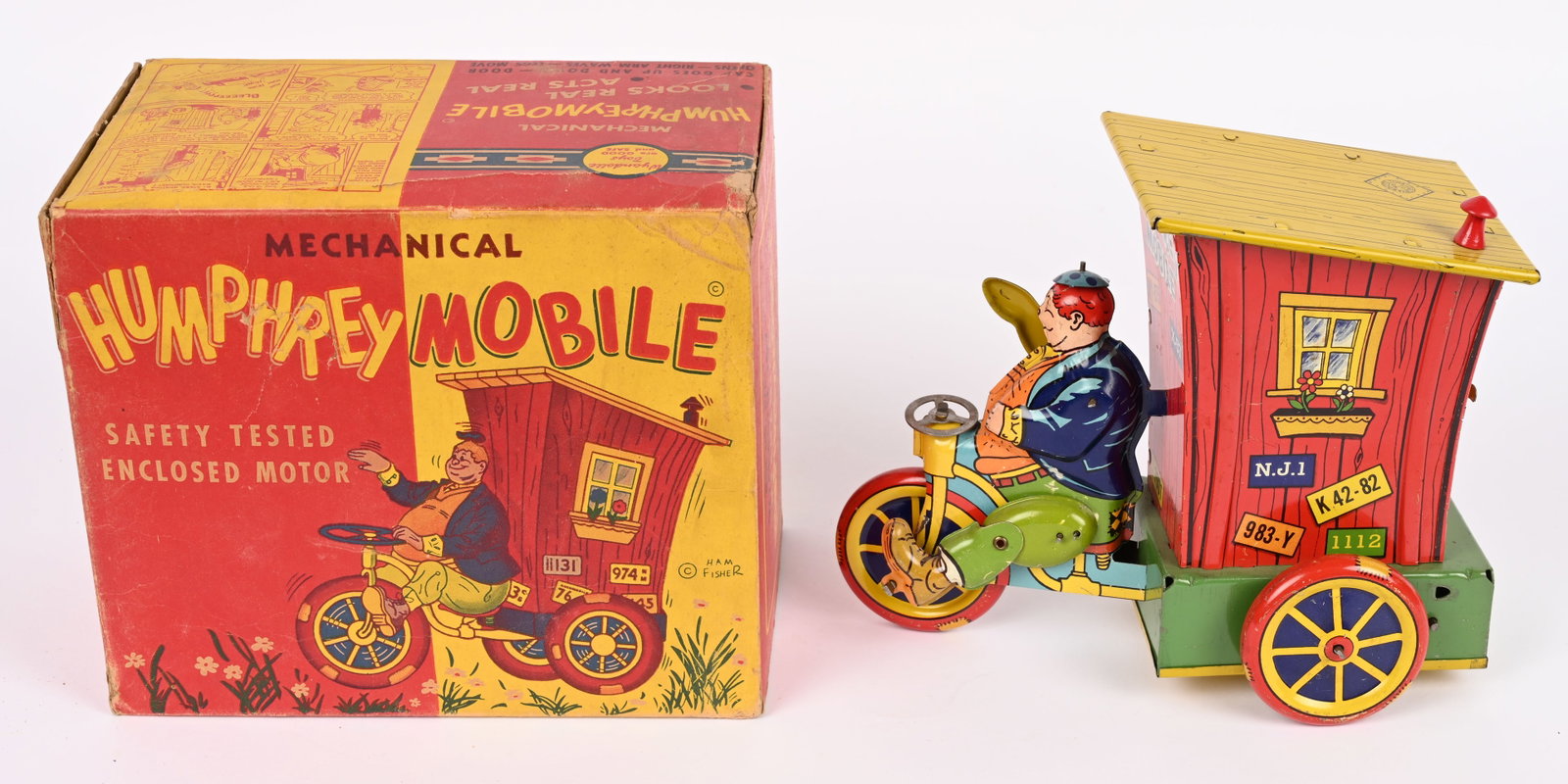 WYANDOTTE TIN WINDUP HUMPHERY MOBILE w/ BOX: Wyandotte tin windup Humphrey Mobile. All original and in wonderful condition. Very nice colors. Still has plastic smoke stack. Windup works. Boxed 9" Excellent