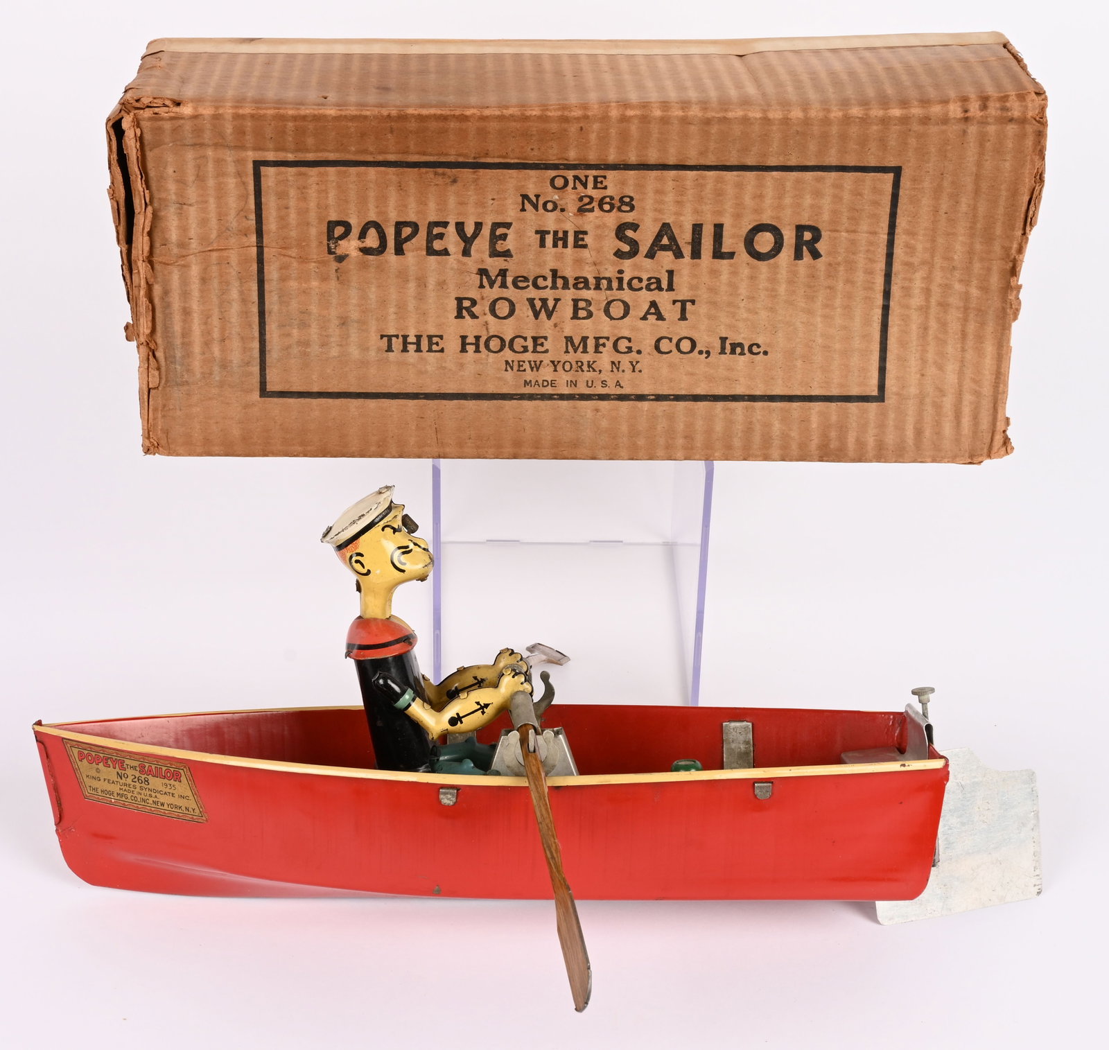 HOGE WINDUP POPEYE IN ROW BOAT w/ BOX: RARE Hoge windup Popeye in Row Boat. All original in wonderful condition. Still has original oars and rudder. Colors are very bright and glossy. Original label is very strong. Windup works. A rare