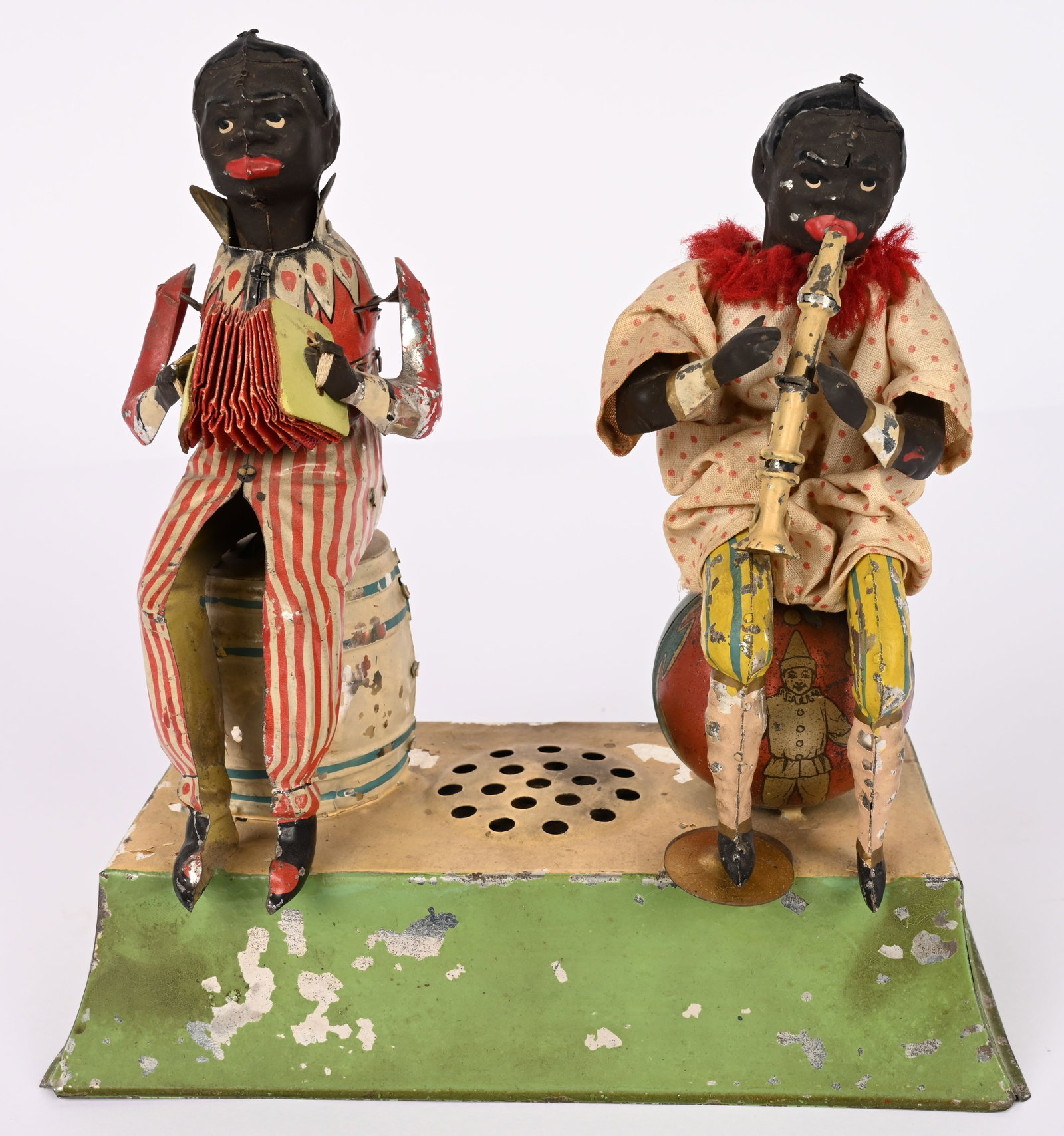GUNTHERMANN WINDUP BLACK MUSICIANS ON PLATFORM: German hand painted tin windup Black Musicians on Platform. One playing Accordion the other Flute & Cymbals. All original with great colors and details. Windup works and still plays music. 8 1/2"