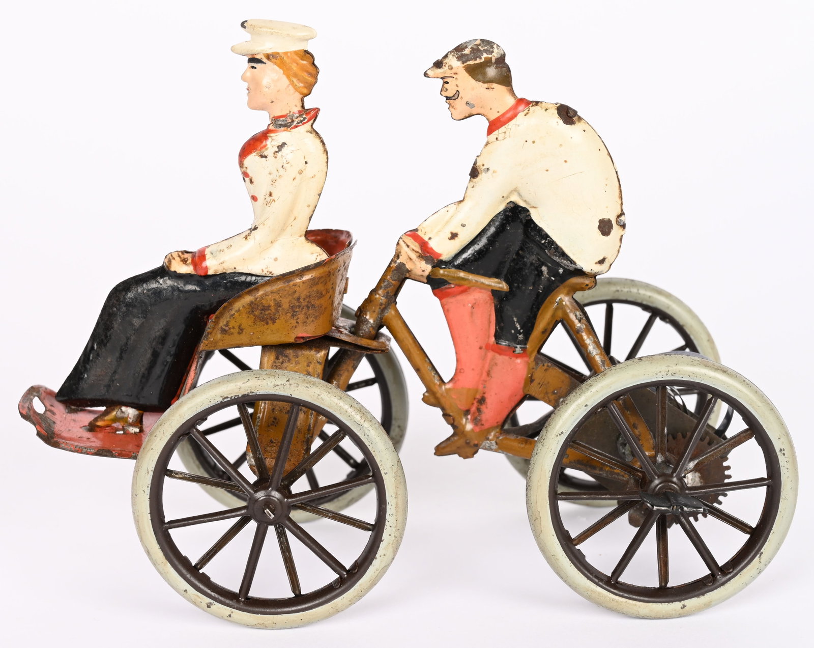 GERMAN WINDUP MAN ON BICYCLE w/ WOMAN: German windup hand painted tin Man on Bicycle pushing Woman. Great looking design. Mostly original with a few spots of touchup under blacklight. Windup works. Very nice toy. 6" Excellent