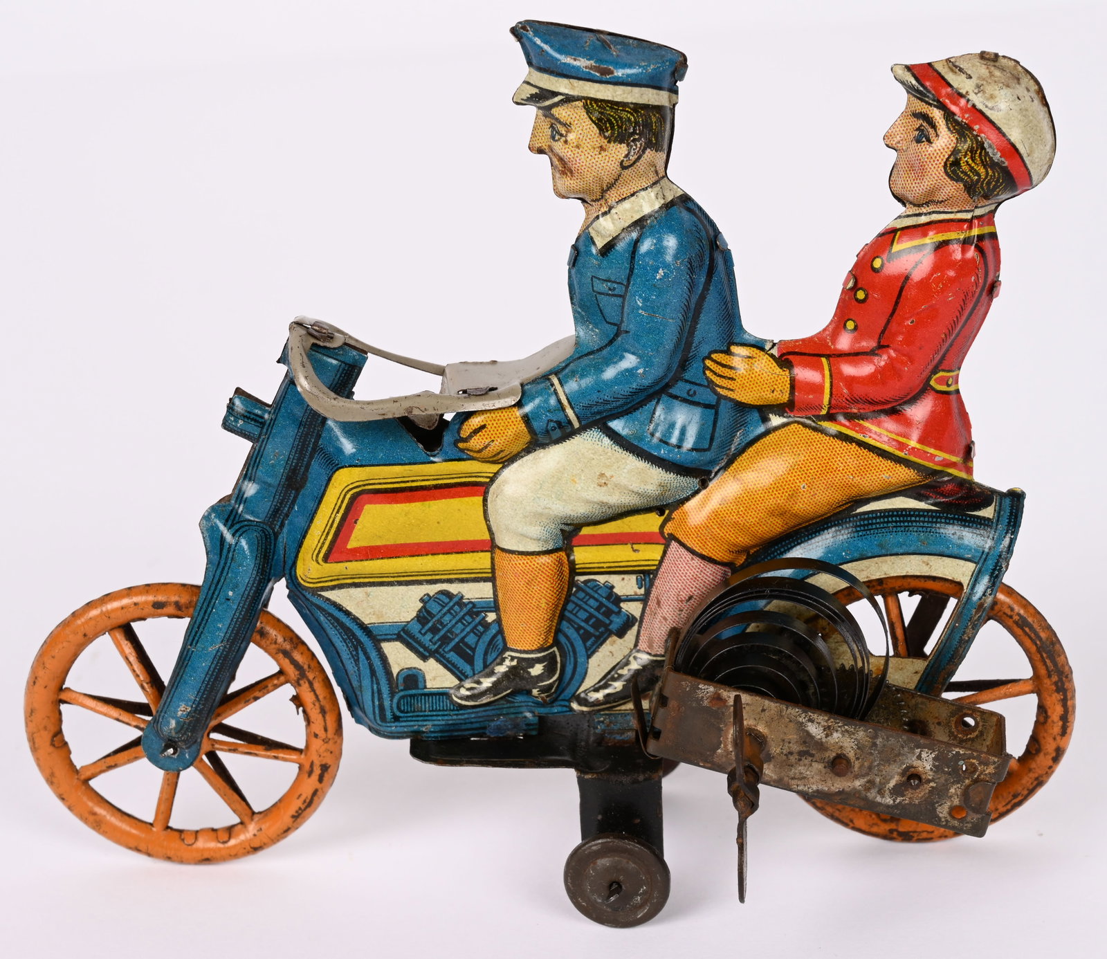 GELY TIN WINDUP MOTORCYCLE WITH FEMAILE PILLION: RARE George Levy tin windup Motorcycle with Female Pillion. All original and in beautiful condition. Very nice colors and details. Windup works. A wonderful early Motorcycle toy. 5 1/2" Excellent