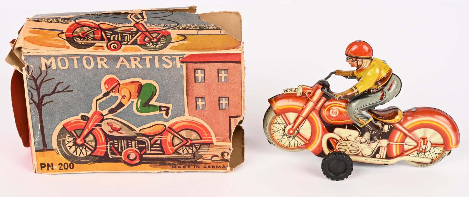PN TIN WINDUP MOTOR ARTIST MOTORCYCLE w/ BOX: Western Germany tin windup Motor Artist Motorcycle. Looks never played with condition. Windup works. Box missing end flaps. 6 1/2" Excellent