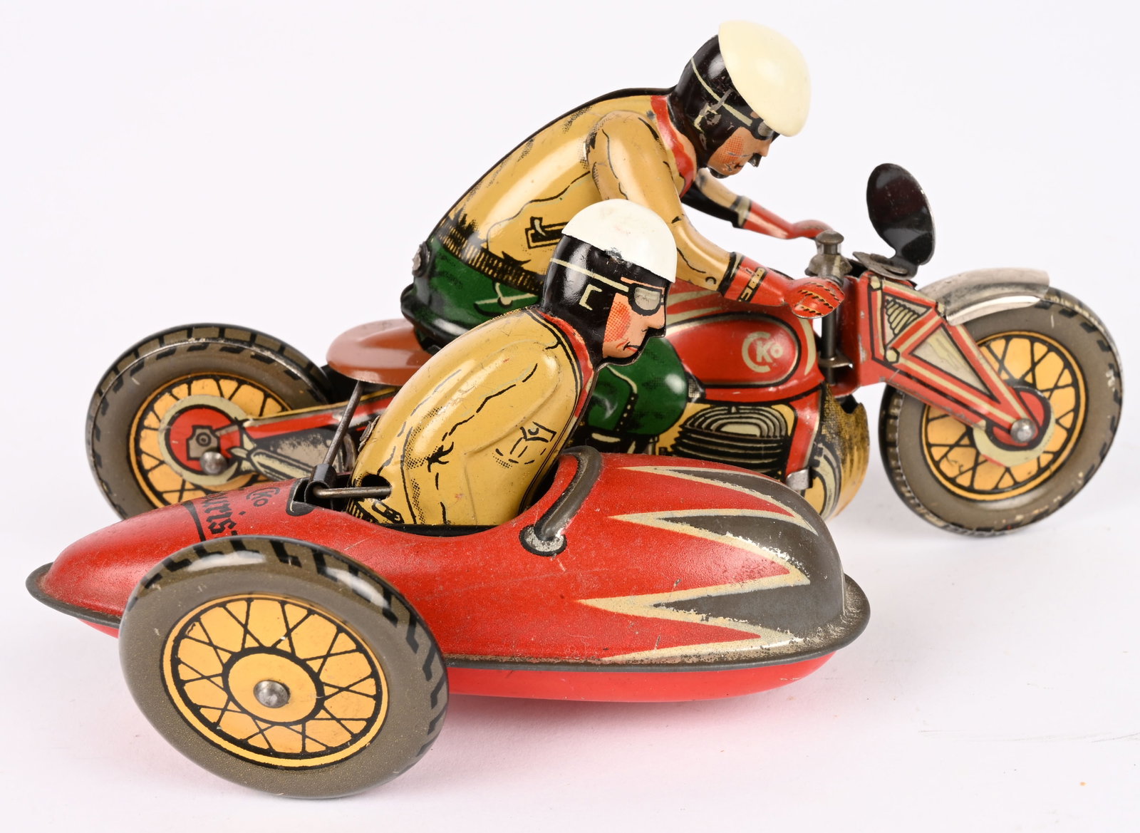 CKO TIN WINDUP TOURIST MOTORCYCLE & SIDECAR: CKO tin windup Tourist Motorcycle with Sidecar. All original with driver and passenger. Great condition. Very nice colors. Windup works. 6" Excellent