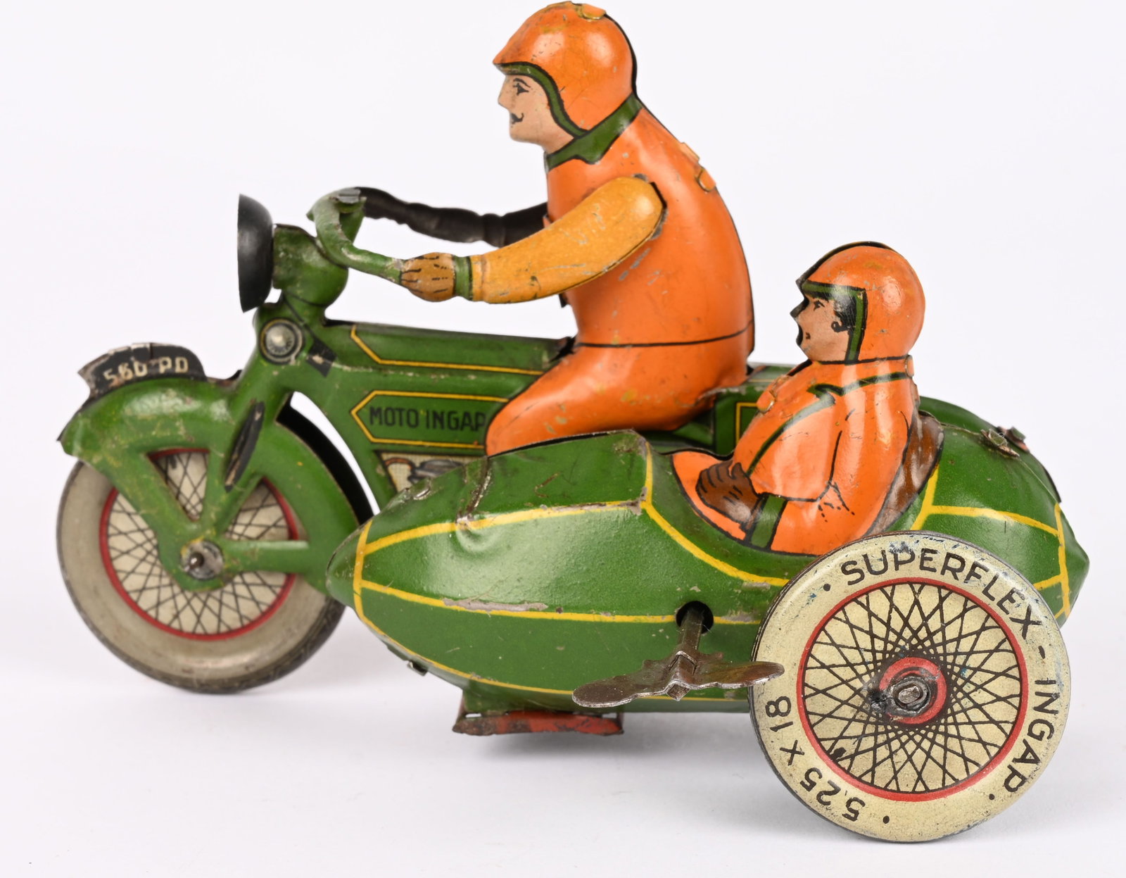 INGAP TIN WINDUP MOTORCYCLE WITH SIDECAR: Ingap tin windup Motorcycle with Sidecar. All original with great colors and design. Has bullet style sidecar. Unusual green color. Windup works. Has some touchup. 5 1/4" Excellent