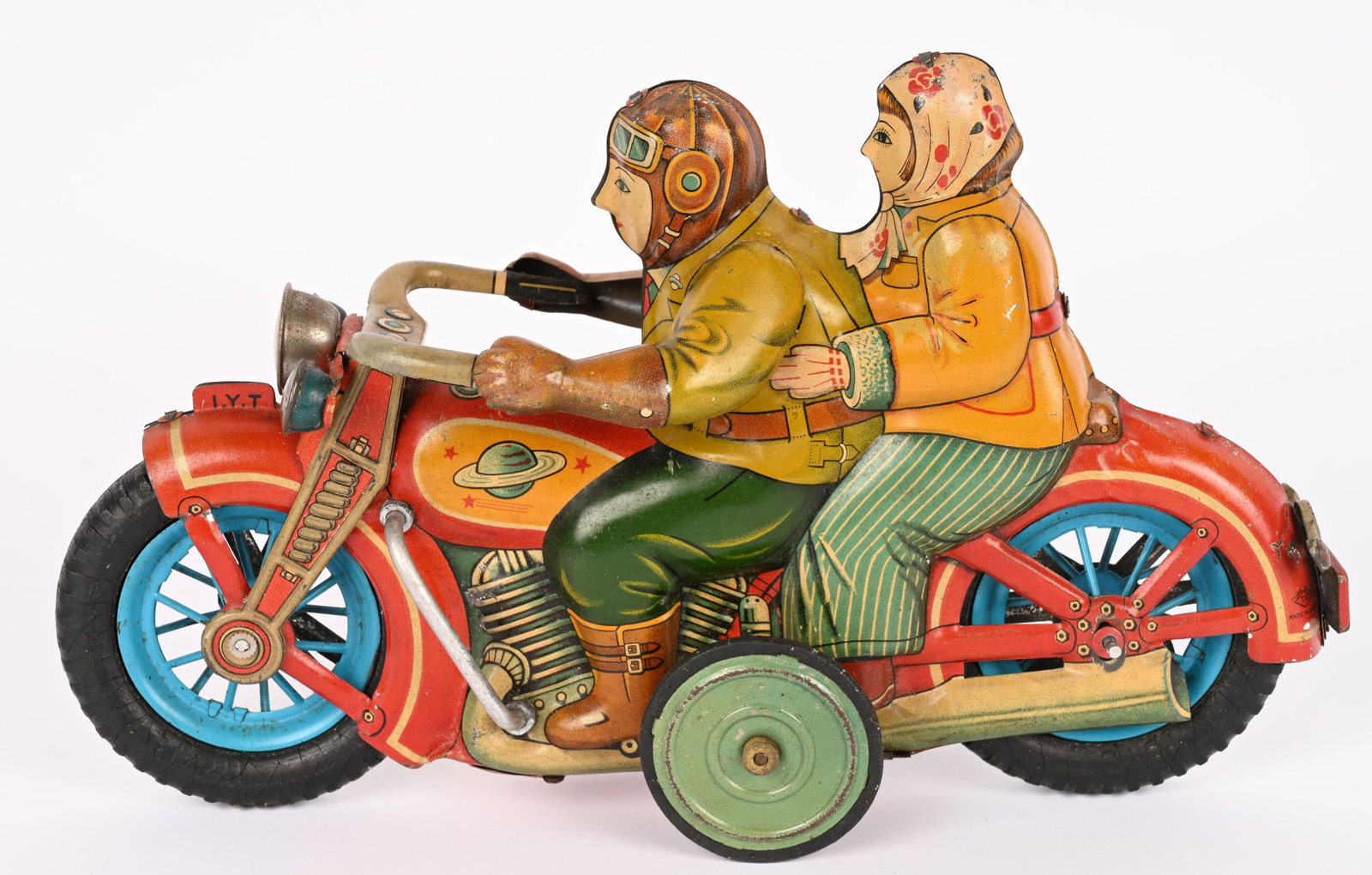 I.Y. TOYS LARGE ROMANCE MOTORCYCLE: Japan tin friction Romance Motorcycle. Great looking bike with Man and Woman riders. All original with nice colors. Has some minor wear mostly on one side. Friction works. 7 1/2" Excellent