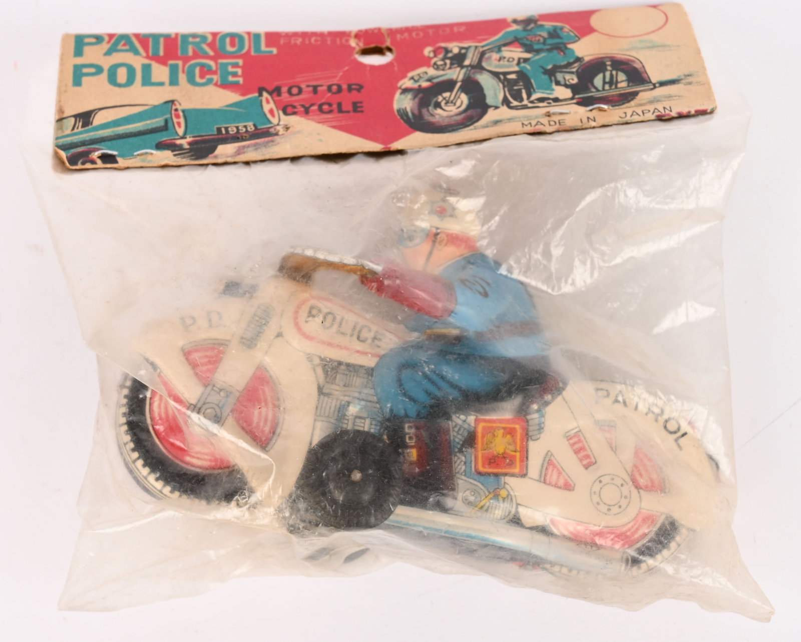 JAPAN TIN FRICTION PATROL POLICE MOTORCYCLE MIP: Japan tin friction Patrol Police Motorcycle. Sealed in Rack Pack. 4 1/2" Excellent