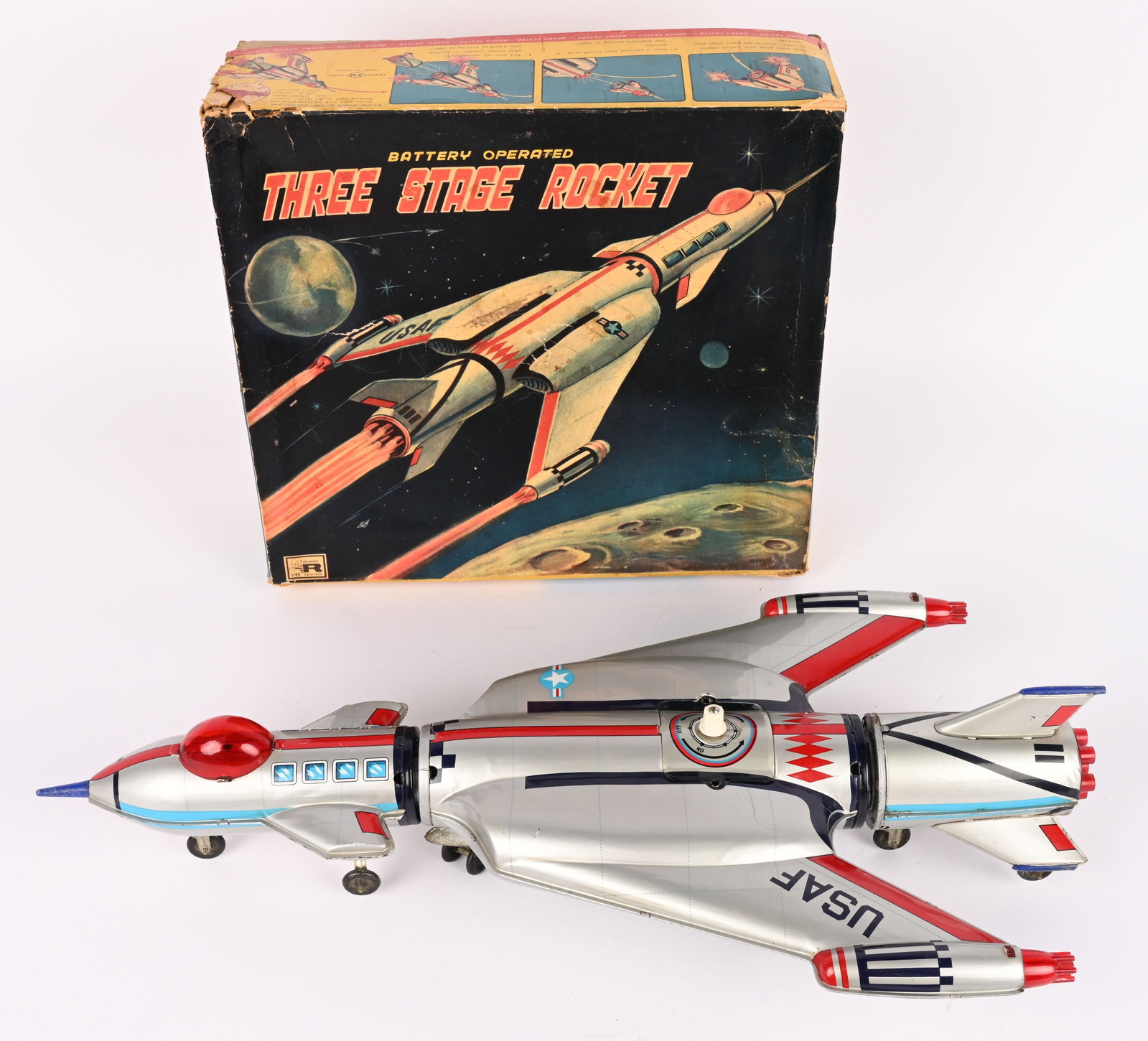 NOMURA BATTERY OP THREE STAGE ROCKET w/ BOX: Japan battery operated Three Stage Rocket. All original and complete. Very clean condition. Worked when tested. With Box. 21" Excellent
