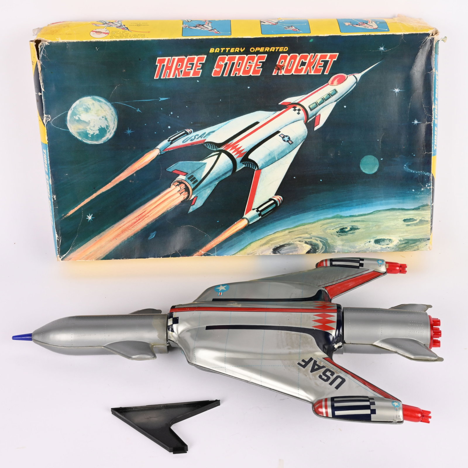 NOMUAR BATTERY OP THREE STATE ROCKET w/ BOX: Japan battery operated Three Stage Rocket. All original and complete. Very clean condition. Has some breaks on plastic pieces. Worked when tested. With Box. 21" Very Good-Excellent