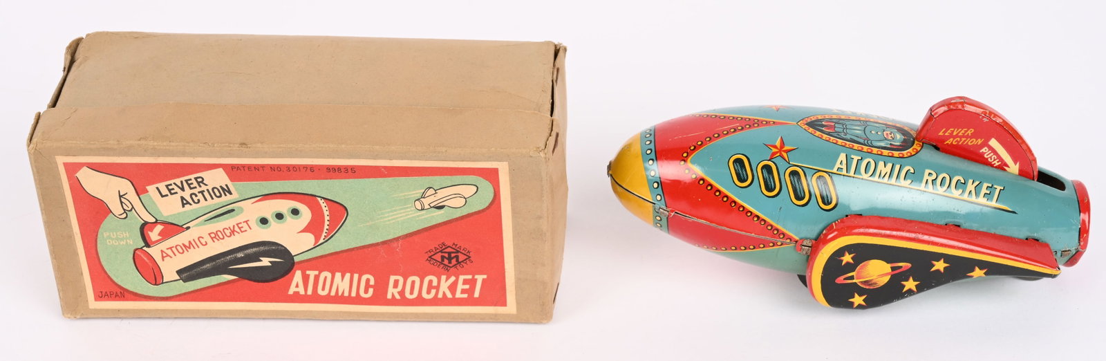 MT TIN WINDUP ATOMIC ROCKET w/ BOX: Japan tin windup Atomic Rocket. All original and looks never played with condition. Push down tail to wind the toy. Works well. Comes with Box 6 1/2" Excellent