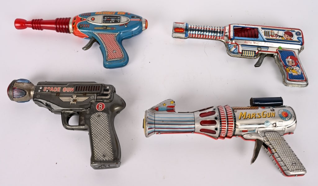 LOT OF VINTAGE SPACE GUNS: Includes Mars Gun, Eagle Space Gun, Space Ray Gun, and Astroray Gun. One of the ray guns the plastic red lense is not attached on one of the sides. All original in nice condition. Largest 10"