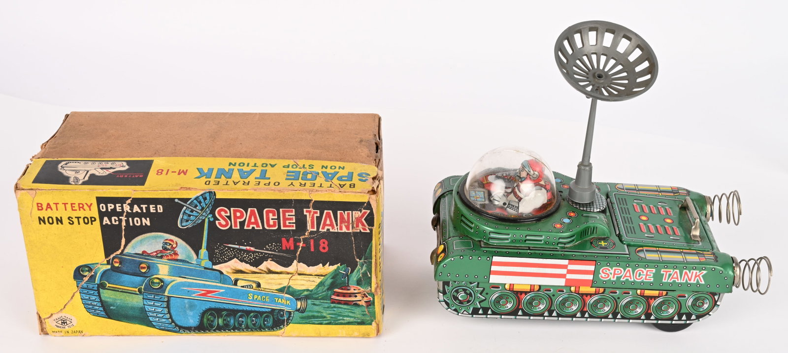 NOMURA BATTERY OP SPACE TANK M-18 w/ BOX: Japan battery operated Space Tank M-18. All original in clean condition. Comes with antenna but the middle piece in the dome is missing. Dome has tight crack. Worked when tested. With Box that has rep