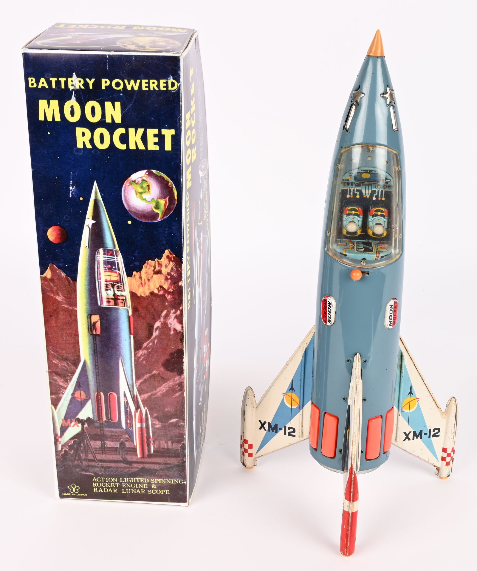 YONEZAWA BATTERY OP MOON ROCKET XM-12: Japan battery operated Moon Rocket XM-12. All original in nice condition. Worked when tested. Comes with reproduction Box. 14" Excellent