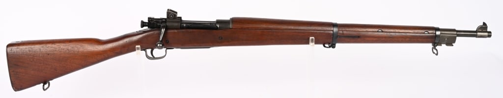 WW2 SMITH CORONA MODEL 03-A3 BOLT ACTION RIFLE: SERIAL NUMBER: 4771400. BARREL: 24". CALIBER: .30-06. MANUFACTURED: 1943. Smith Corona barrel, dated "9-43" under a flaming bomb. Original parkerized finish. Straight grip wood stock has been sanded/o