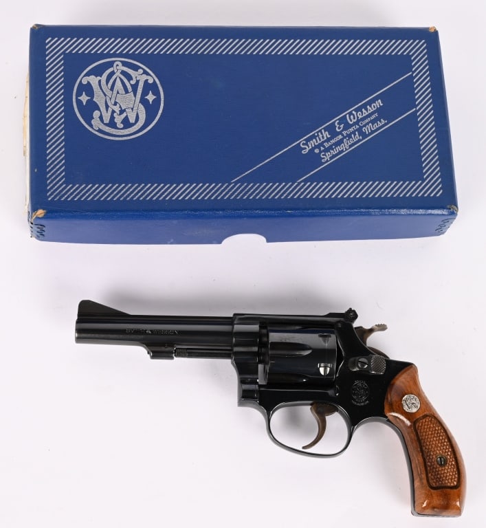 BOXED SMITH & WESSON MODEL 34-1 .22LR DA REVOLVER: SERIAL NUMBER: M192403. BARREL: 4". CALIBER: .22 LR. MANUFACTURED: 1965 - 1974. Standard markings and six shot fluted cylinder. Pinned barrel, with ramped blade front sight and rear sight removed. Top