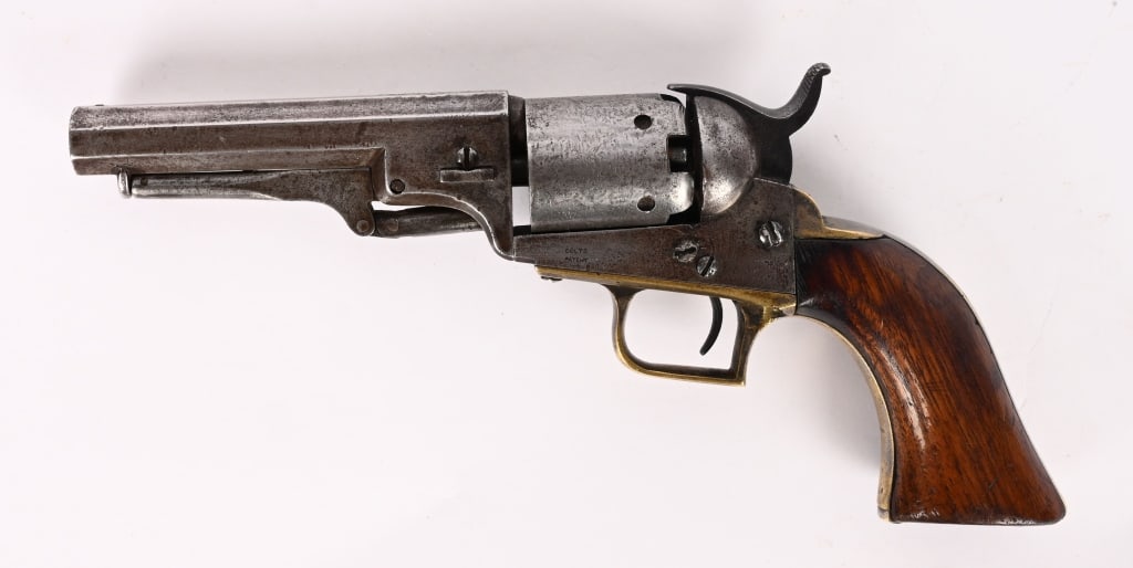 COLT MODEL 1848 BABY DRAGOON REVOLVER: SERIAL NUMBER: 2532. BARREL 4". CALIBER 31. MFG: 1848 . Features octagon barrel, round cylinder stops, square back brass trigger guard. Unusual variation with period fitted loading lever. Has 2 line C