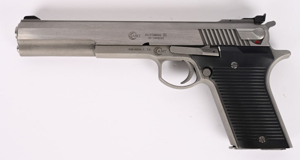 SCARCE AMT 30 CARBINE SEMI AUTOMATIC PISTOL: SERIAL NUMBER: A07719. BARREL: 6 1/2". CALIBER: .30 CARBINE. Manufactured: MID 1990s. The AMT AutoMag III chambered in .30 Carbine is a distinct, large-frame semi-automatic pistol designed by Harry Sa