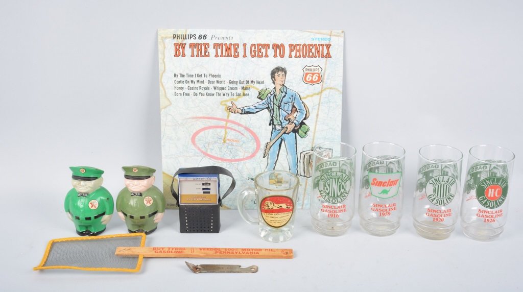 11 GASOLINE PROMOTIONAL ITEMS: Includes 2 Texaco Banks, 4 Sinclair Glasses, American Gas Pump Radio, Bedol Fly Swater, Standard Oil Can Opener, Lion Oil Products Mug, and Phillips 66 Record. Very Good-Near Mint