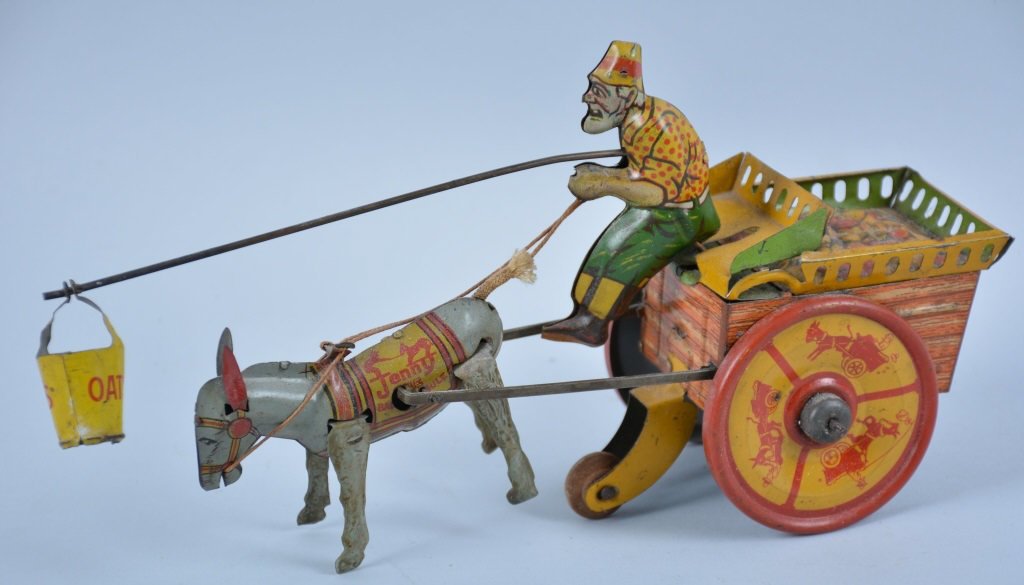 STRAUSS TIN WINDUP JENNY THE BAULKING MULE: All original with original feed bucket. Excellent