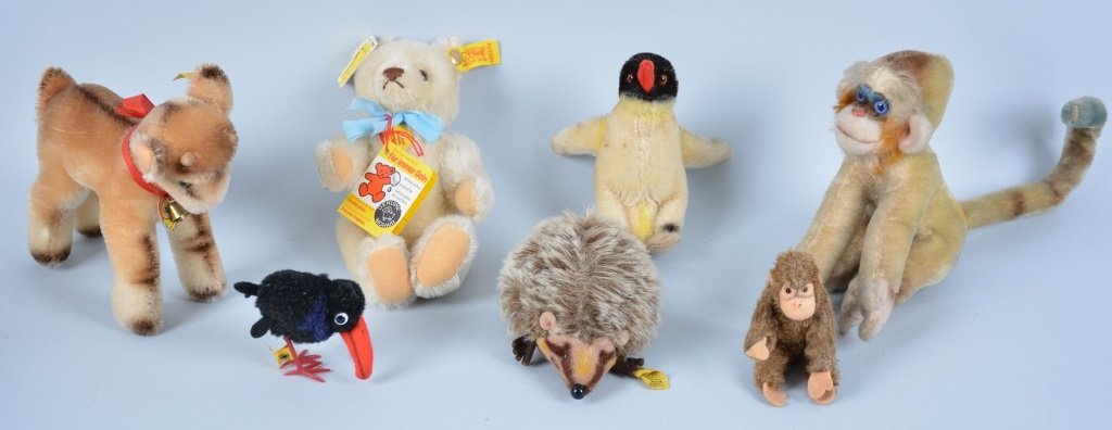 Lot of 7 STEIFF MINI STEIFF ANIMALS: Great collection includes Zicky, Teddy Bear, Monkey, Porcupine, Black Bird, Monkey, and Penguin. Some with Tags and Buttons. Largest 6". Excellent-Near Mint
