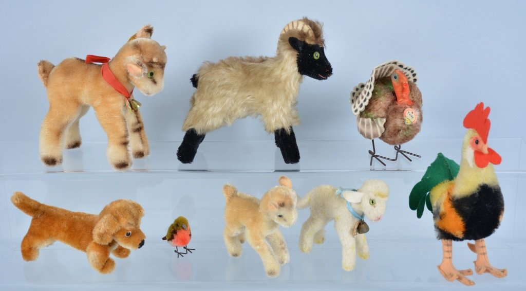 Lot of 8 STEIFF MINI ANIMALS: Collection includes Zicky, Lamby, Snucki, Tucky, Rooster, Baby Goat, Dog, and Mini Bird. Some with Tags and Buttons. Largest 6" Tall. Excellent-Near Mint