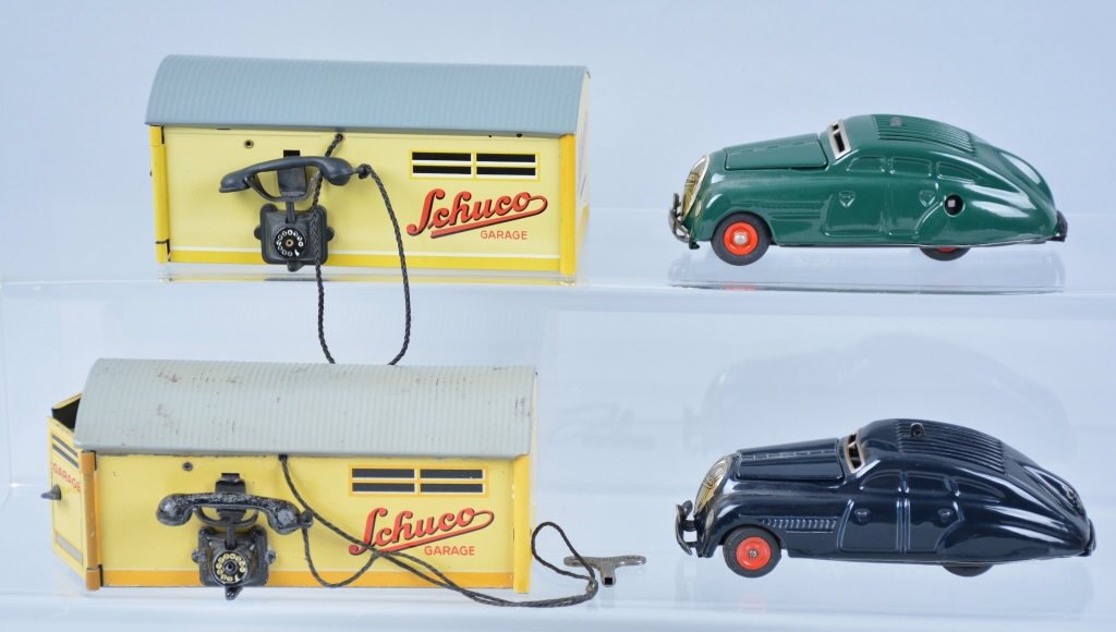Lot of 2 SCHUCO GARAGES WITH CARS: Both all original with nice colors. One has green car the other black car. Both windup cars. Excellent