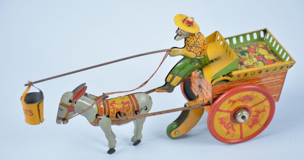STRAUSS TIN WINDUP JENNY THE BALKING MULE: All original and complete including bucket. Great color and graphics. Excellent