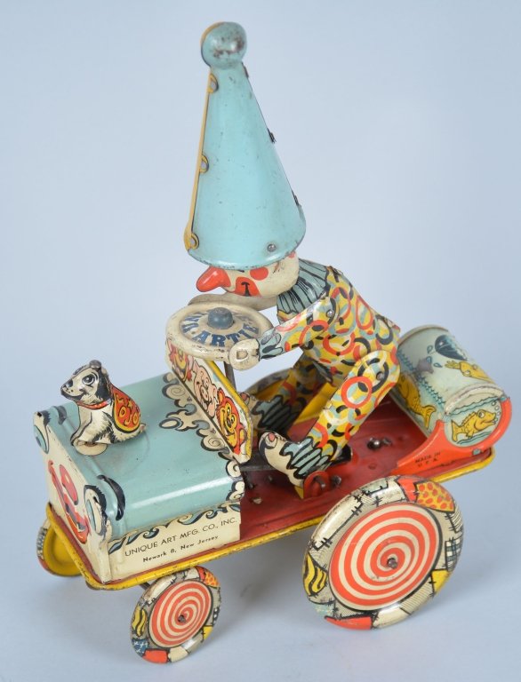 Unique Art Tin Windup Artie the Clown: Excellent working condition with minor wear, Missing rubber ears.