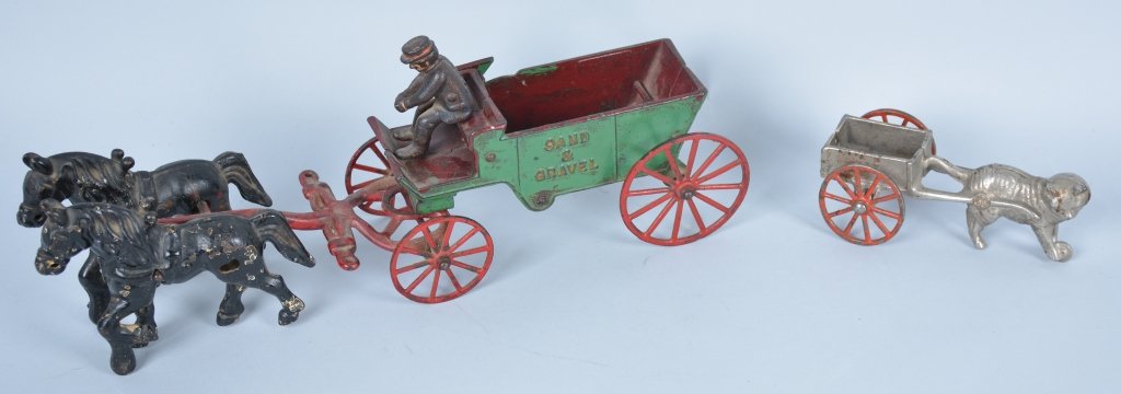 Stevens Cast Iron Cat Cart and Kenton Sand and Gravel: Stevens toy is 6" long and excellent condition, but missing driver. Kenton wagon is 15" long and has some overpaint.