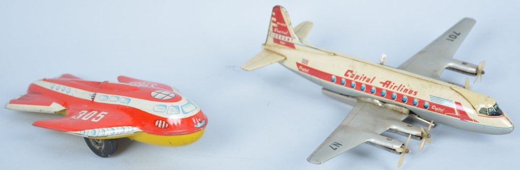 Lot of Tin Rocket Space Ship and Capital Airlines Plane: Space ship is very good, friction motor works and is 8 1/2" long. Capital Airlines plane is very and friction lever and landing gear work, 11" wings span.