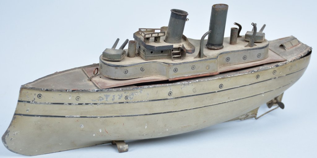 1900s Carette Man O War Boat: Very scare all original early Carette Boat. 14" Long. Missing lifeboats and rails. Missing mech. Does have nice original paint. May clean to higher grade. Very Good