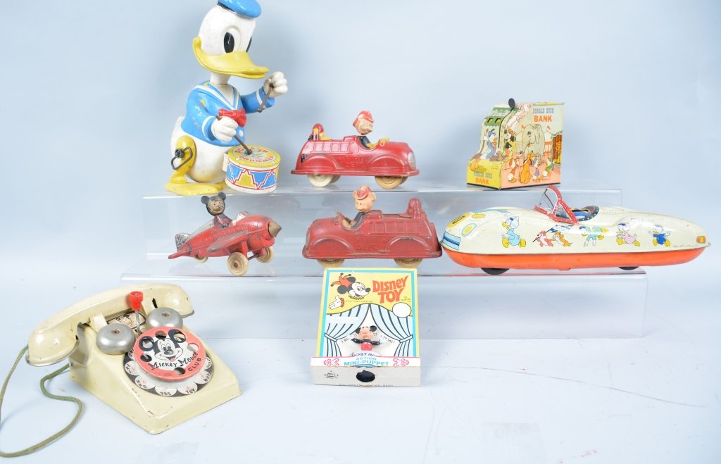Lot of 8 DISNEY TOYS: Includes Marx Donald Drummer, Mickey Mouse Club Telephone, Donald Duck bank, Mickey Push Puppet, Donald Racer, and 3 Sun Rubber Toys. Some missing parts. Good-Very Good