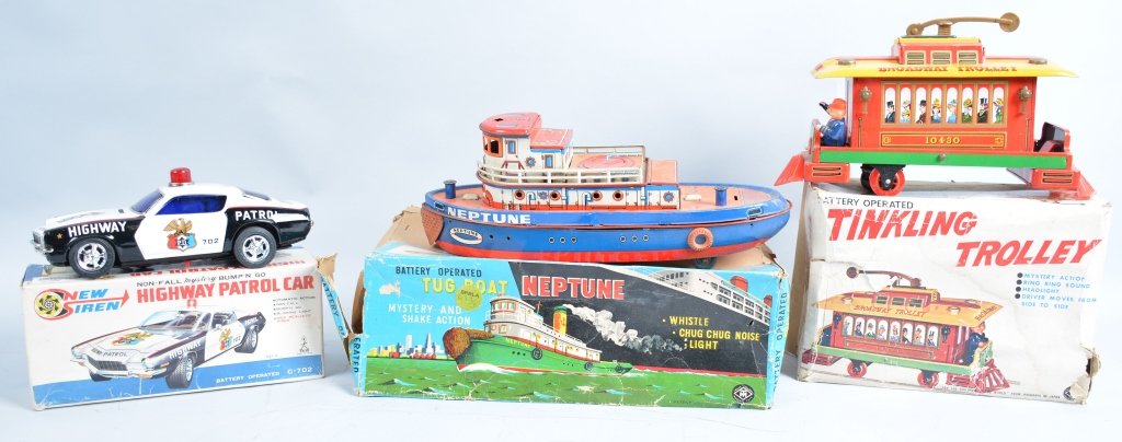 Lot of 3 BOXED BATTERY OP TOYS: Includes Highway Patrol Car Bump'N Go, Neptune Tug Boat, and Tinkling Trolly. All boxed. Some missing parts. Excellent